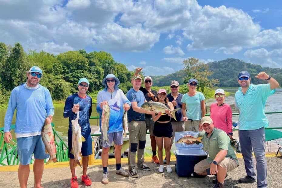 Group of people from maritime companies with their catch of the day, Gamboa, Panama Canal