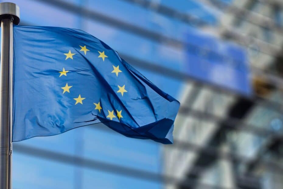 EU flag in front of a building & global gateway logo